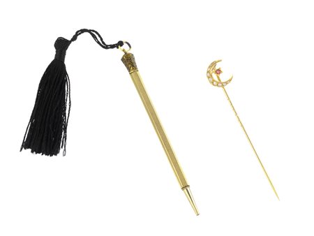 LOTTO COMPOSTO DA PENDENTE, ANELLO, SPILLONE E PORTAMINE IN ORO GIALLO il...