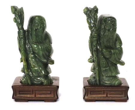 GIADA, Coppia di sculture in giada raff. "Santoni" - h 11 cm - Cina XX sec.