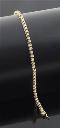 Bracciale tennis in oro giallo con diamanti
