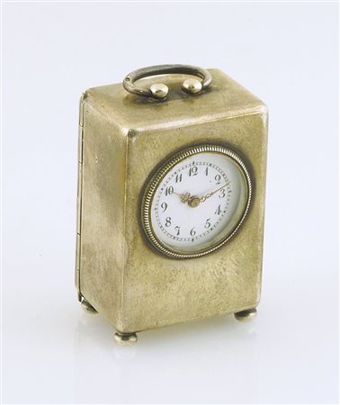 Orologio sveglia da tavolo in argento. H. cm. 5.