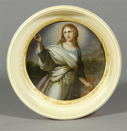 Miniatura rotonda su tavoletta raffigurante Santa, entro cornice in avorio....