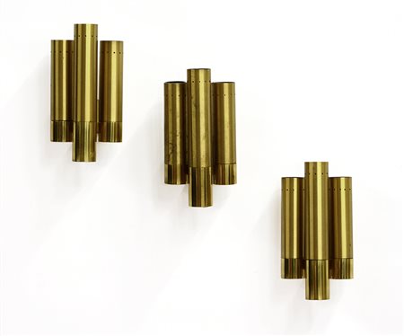 Gruppo di tre appliques a tre fiamme in ottone lucidato e spazzolato. Italia,...