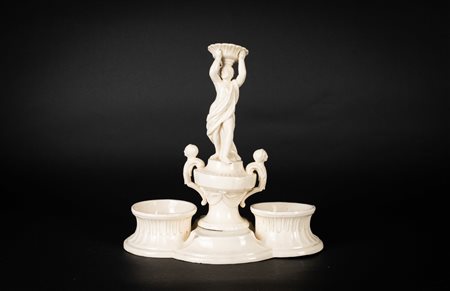 MANIFATTURA VENETA DEL XIX SECOLO Oliera in terraglia con figura femminile. ....