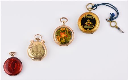 QUATTRO OROLOGI DA TASCA di cui tre in oro a basso titolo e smalti ed uno in...