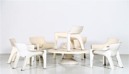 MAGISTRETTI VICO (1920 - 2006) Otto poltrone mod. Vicario, un tavolino...