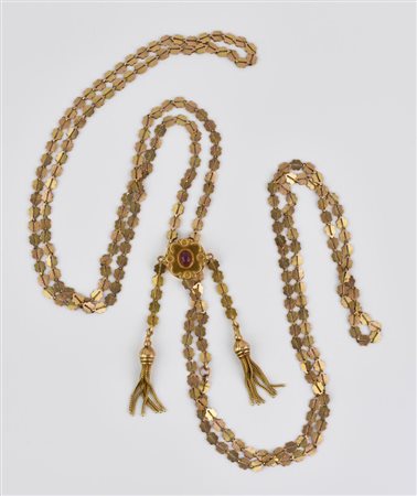 COLLANA SALISCENDI IN ORO A BASSO TITOLO E RUBINO realizzata ad una lunga...