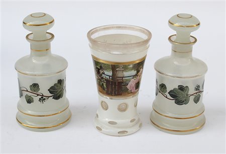 Lotto composto da due bottigliette in vetro lattimo ed un bicchiere in vetro...