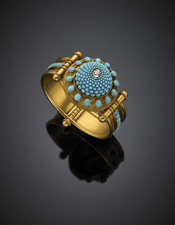 Bracciale rigido alla schiava in oro giallo, finemente rifinito a più ordini...