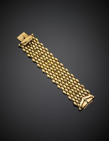Bracciale modulare a fibbia in oro giallo e rosa, le losanghe rifinite con...