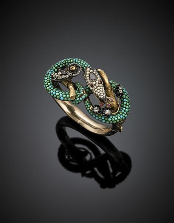 Bracciale rigido in oro giallo, rosso cesellato e argento a guisa di drago...