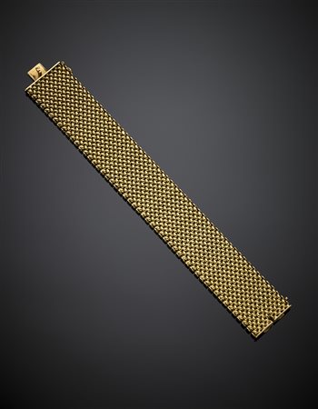 Bracciale in oro giallo a fascia intrecciata, g 84,62, lungh. cm 20,50...