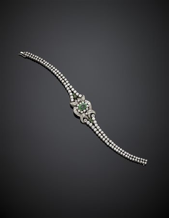 Bracciale in oro bianco con diamanti per complessivi ct. 6,60 circa, smeraldi...