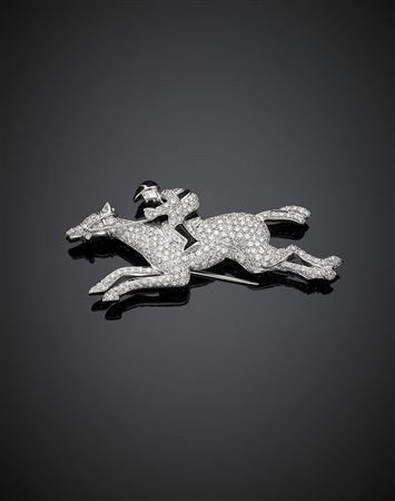 Spilla in oro bianco e diamanti per complessivi ct. 4,50 circa a guisa di...