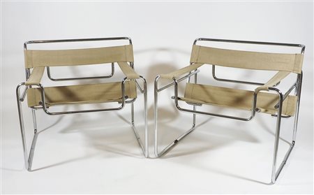 Coppia di poltrone con struttura in acciaio, seduta, schienale e braccioli in...