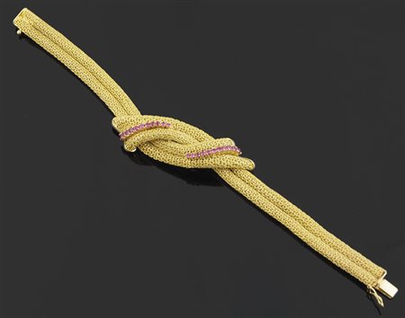 Bracciale in oro giallo a due fili con intreccio centrale e due file di...