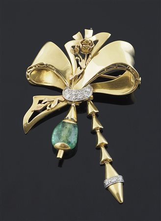 Spilla in oro giallo a forma di fiocco con diamantini e finale di pietra...