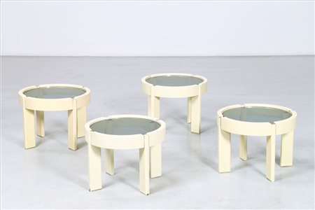 MANIFATTURA ITALIANA Quattro tavolini. Vetro e legno laccato. Cm 41,00 x...