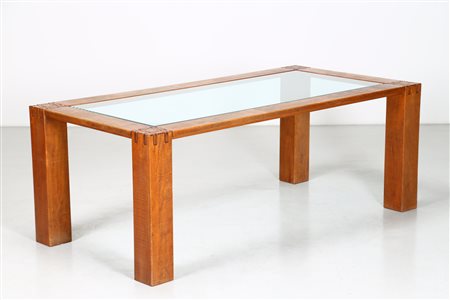 RIVADOSSI GIUSEPPE (n. 1935) Tavolo. Legno di noce e vetro. Cm 200,00 x 74,00...