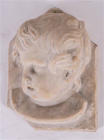 MANIFATTURA ITALIANA DEL XVII SECOLO Testa d'angelo. Marmo bianco. Cm 27,20....