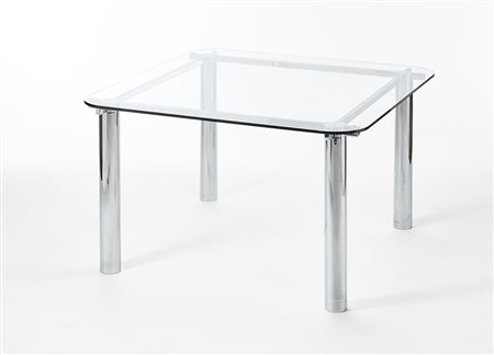 Tavolo con piano in cristallo e gambe in tubolare metallico. Italia, anni...
