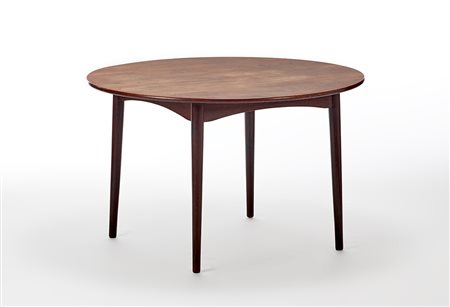 Tavolo allungabile in legno di teak massello con piano circolare. Italia,...