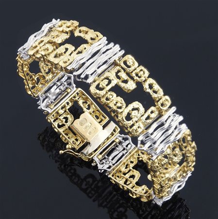 Bracciale in oro giallo e bianco satinato semirigido a settori, gr 47 Uno a Erre