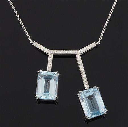 Girocollo in oro bianco con diamanti per tot ca ct 0,40 e due topazi azzurri...
