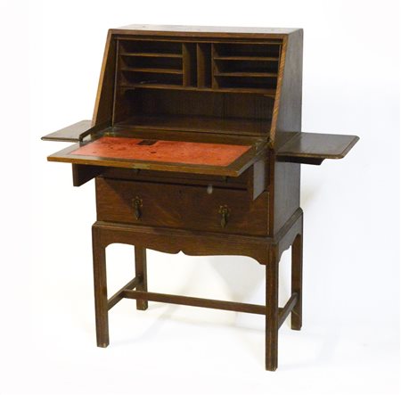 Ribaltina a due cassetti, antina celante vani a giorno, due pianetti laterali...