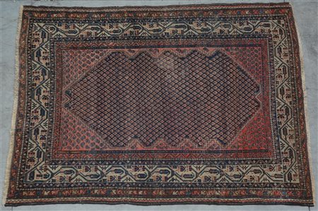 Tappeto Sarab, Persia secolo XX. Campo a fondo blu decorato da fiorellini...