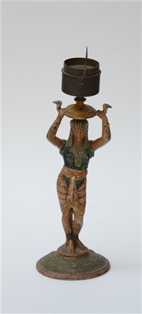 Orologio a lume con corpo decorato in policromia da figura egizia. Fine sec. XI