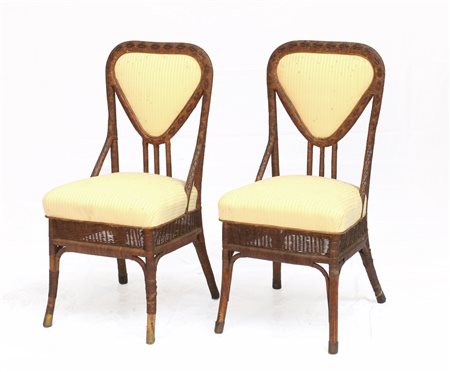 Coppia di sedie in vimini con seduta e schienale in stoffa a righe. Prima metà