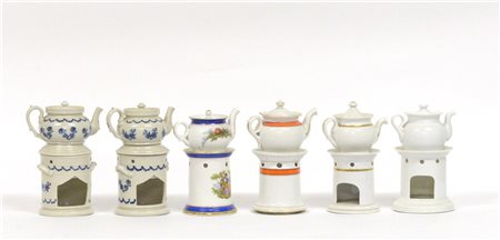 Gruppo di sei veilleuse in porcellana di diverso decoro e manifattura (difetti