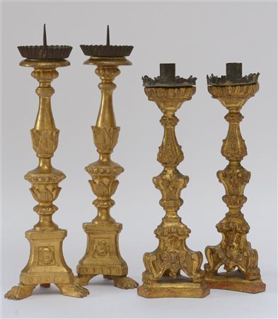 Lotto di due coppie di candelieri in legno intagliato e dorato, secolo XVIII, m
