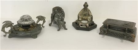 Gruppo di quattro calamai in metallo con decori neorinascimentali e orientali (