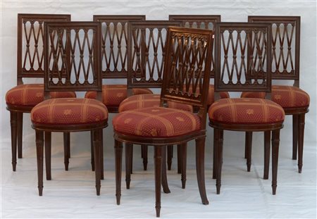 Gruppo di otto sedie in mogano con schienale a giorno a listelli incrociati, ga