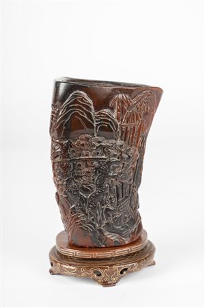 Arte Cinese  A buffalo horn brush pot carved with playing characters China, 20th century .