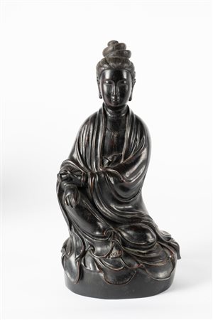 Arte Cinese  A hard wood carved figure of Guanyin China, Qing dynasty, 19th century .