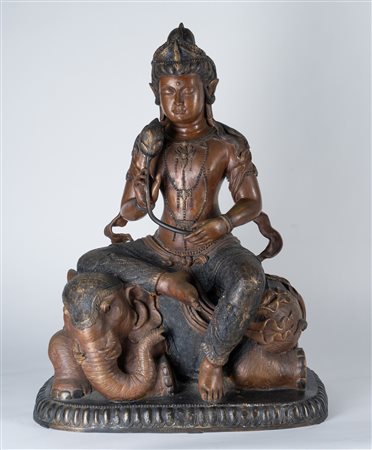 Arte Himalayana  A partialli painted bronze figure of Samantabhadra seated over the back of an  elephant China, 20th century .