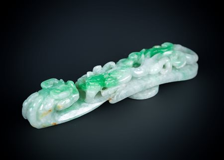 Arte Cinese  An apple green jade buckle carved with chilongChina, 19th century .