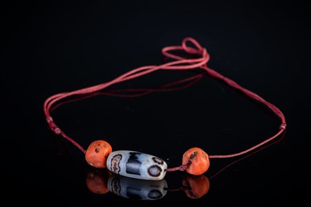 Arte Himalayana  A four eyed agate dzi Tibet, 15th century or later .