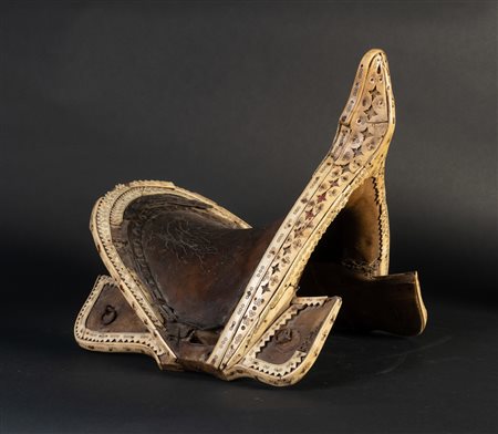 Arte Islamica  A leather and camel bone saddle Central Asia, 19th century .