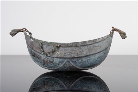 Arte Islamica  A bronze kashkul engraved with epigraphy and stylized vegetal motifs Egypt or Levant, late 19th-20th century .