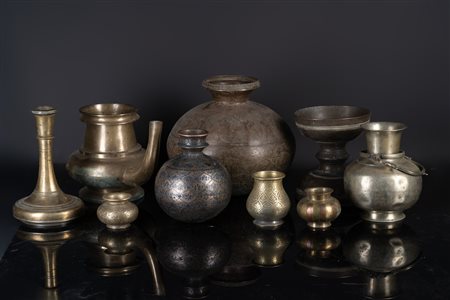 Arte Indiana  A collection of ten metal lotas, vases and huqqa basesIndia, 19th century .