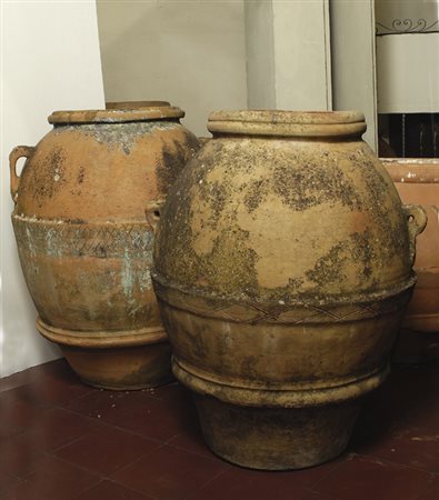Due orci in terracotta, cm. 74x58; cm. 80x70.