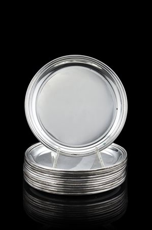 Gruppo di dodici sottobicchieri in argento liscio. Titolo 800. Vicenza, argenti