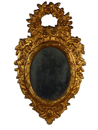Specchiera a ventola toscana secolo XIX in legno intagliato e dorato a foglie...