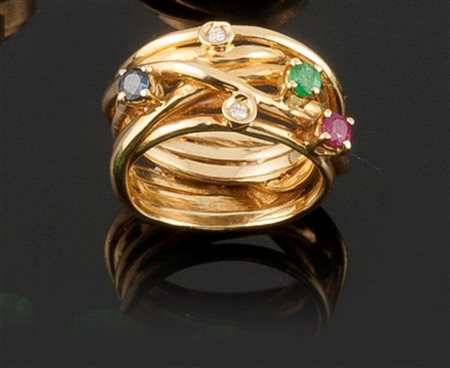 ANELLO Anello in oro giallo lavorato a fili intrecciati con un piccolo...