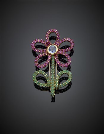 FARAONE
Broche in oro giallo a forma di fiore rifinita con smeraldi per comples