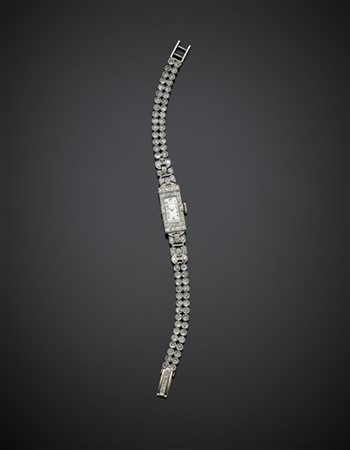 NORMANA
Orologio da polso da donna in platino e oro rifinito con diamanti roton