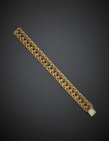 Bracciale in oro giallo rifinito con rubini e turchesi, g 42,06, lungh. cm 17,7